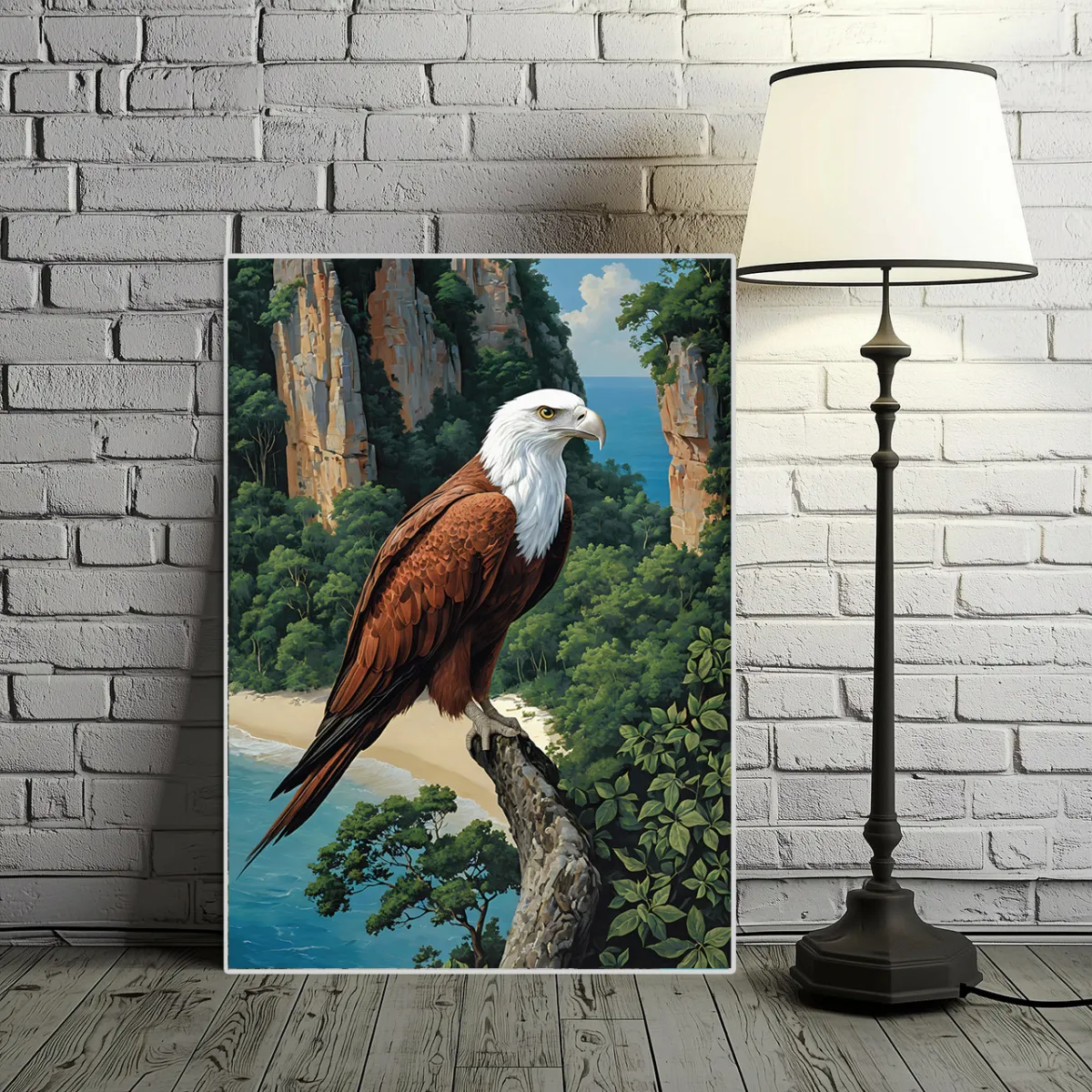 Large TAMAJAD fine art print of a sea eagle on a rocky cliff, displayed next to a floor lamp on a brick wall.