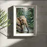 Atmospheric Asian elephant portrait in jungle foliage