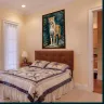 Luxury jungle leopard print displayed above a bedroom bed