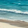 Turquoise tropical waves washing onto white sand